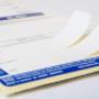Label with removable pull-tabs