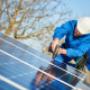 Man installing solar panels