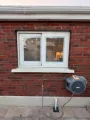 White window fitted in a red brick Dublin home